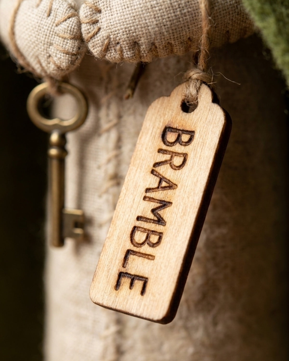 The wooden name tag with BRAMBLE burned into it